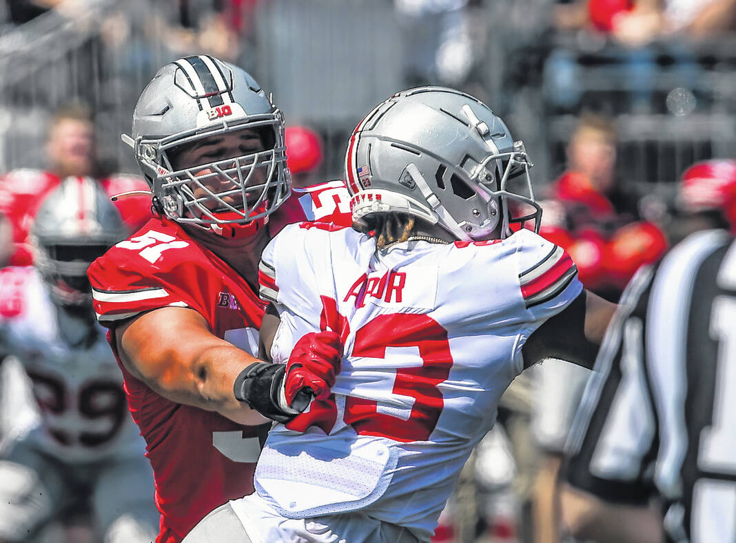 Ohio State football great Archie Griffin runs for a touchdown in the  Buckeyes' spring game 